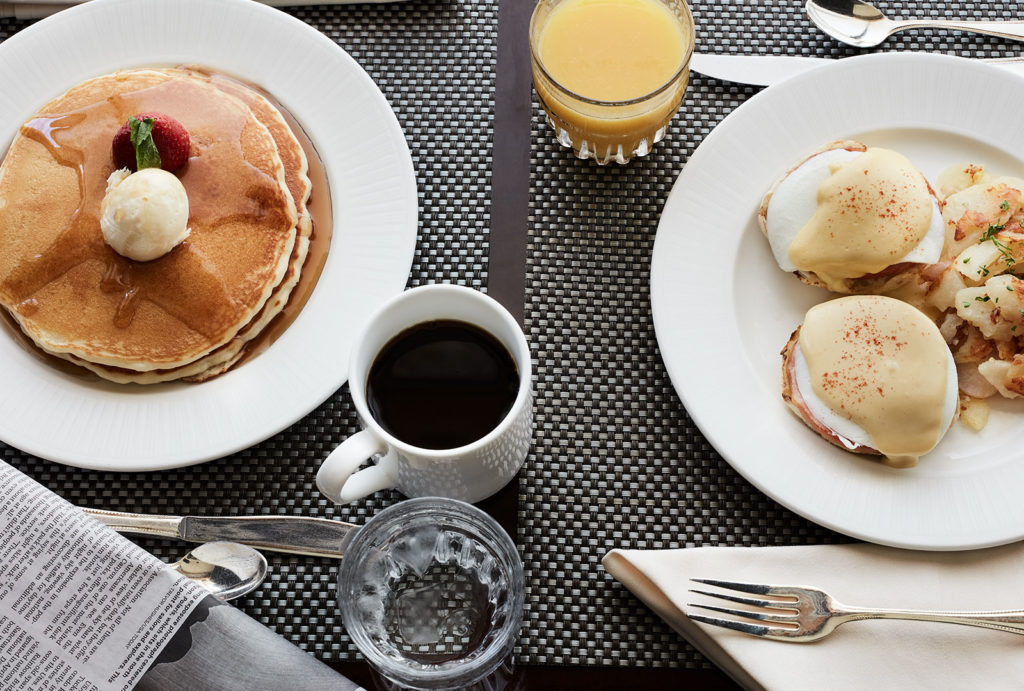 Pancakes, coffee, orange juice, and Eggs Benedict from the Little America Hotel in Salt Lake City.
