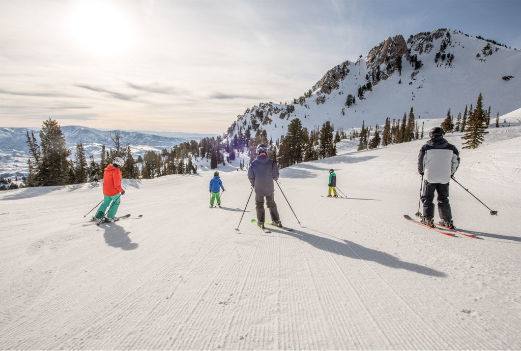 Skiers at Snowbasin Resort in Utah.