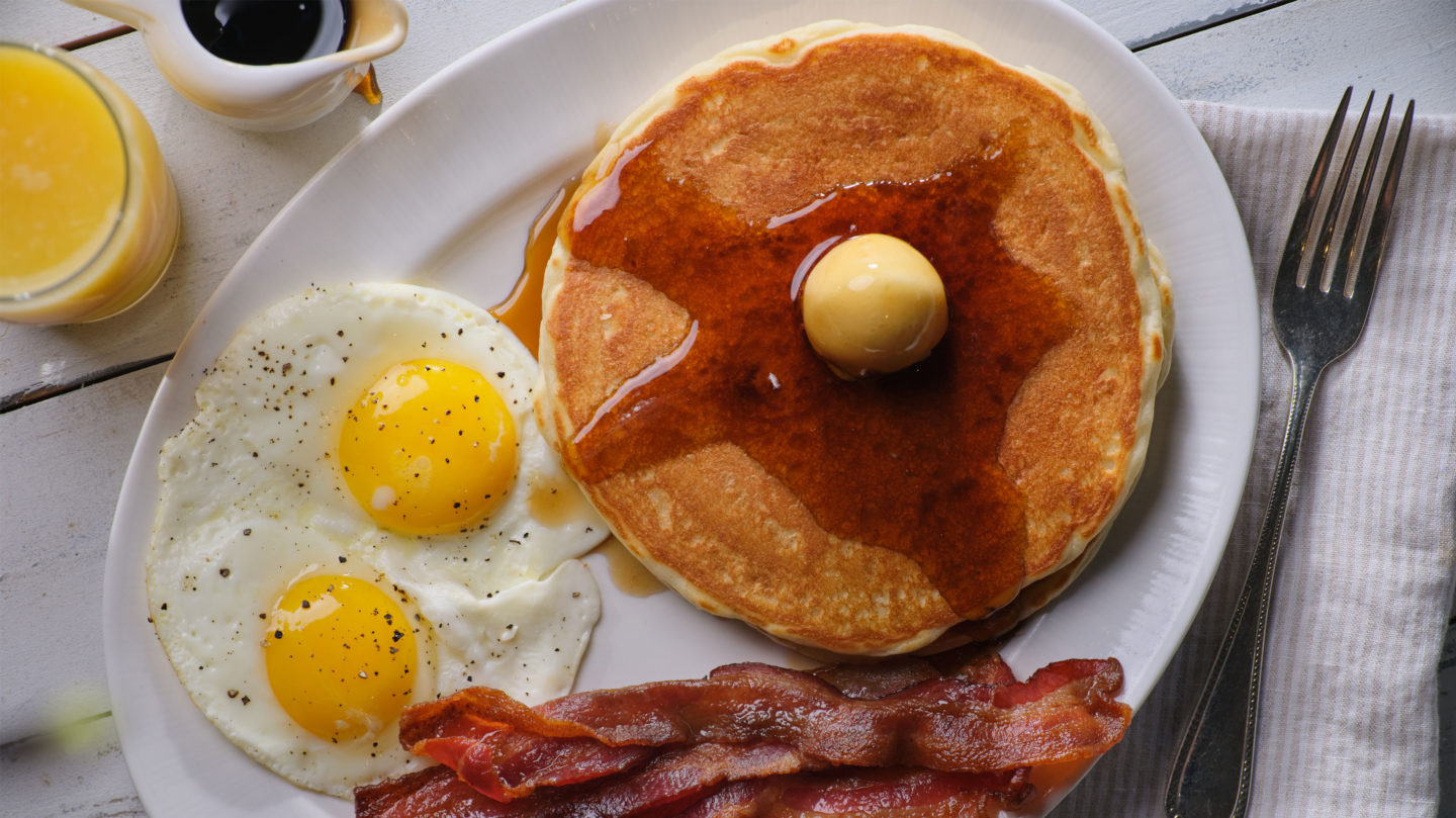 Pancake, egss, bacon, juice and syrup from the Little America Coffee Shop.